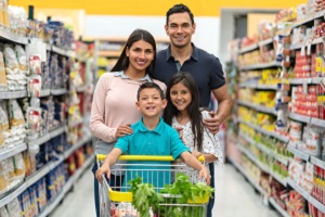 Young Family Grocery Shopping with Cart